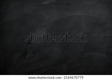 Texture of chalk on blank black blackboard or chalkboard background. School education, dark wall backdrop, template for learning board concept.