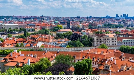 Old town of Prague. Czech Republic over river Vltava with Charles Bridge on skyline. Prague panorama landscape view with red roofs.  Prague view from Petrin Hill, Prague, Czechia. Royalty-Free Stock Photo #2164671067