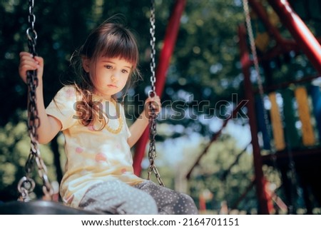 
Sad Little Toddler Girl Playing Alone in the Playground. Unhappy child plays by himself feeling anxious and insecure
 Royalty-Free Stock Photo #2164701151