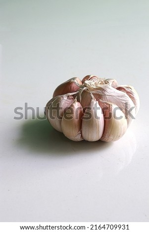 There are several types of onions, and this one is a lump of garlic Royalty-Free Stock Photo #2164709931