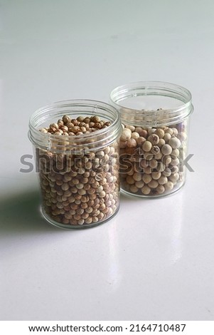 Coriander and pepper are two ingredients that are often used by Indonesian people. how to use it is to grind until smooth along with other cooking spices. Royalty-Free Stock Photo #2164710487