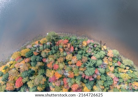 Colgate Lake in Upstate New York during peak fall foliage season.