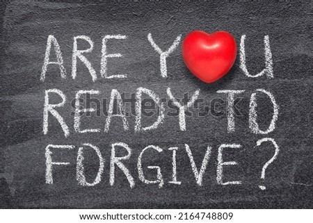 are you ready to forgive question written on chalkboard with red heart symbol

