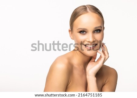 Portrait of beautiful calm woman with young clean healthy skin, studio shot isolated on white background. Anti-aging and beauty treatment.