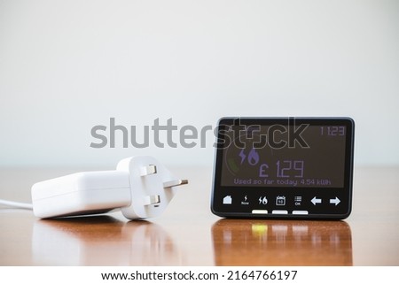 Smart meter placed next to an electric plug