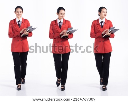 Full length 20s young Mix Race Woman business  financial accountant, walking forward left right, wear formal blazer tie and shoes. Office female stands feels happy smile over white background isolated