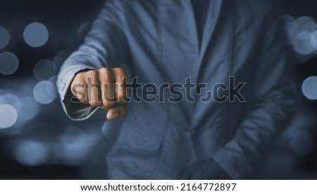 Hand of a businessman with bokeh blurry light background. business concept.