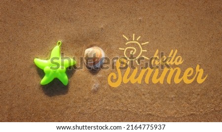 Top view image of sandy summer beach and plastic star fish
