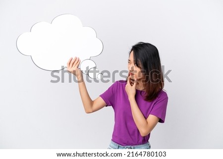 Young Vietnamese woman isolated on white background holding a thinking speech bubble