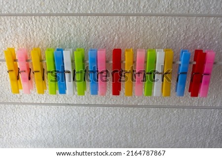 colorful clothespins on a white background