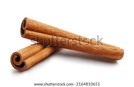 Two delicious cinnamon sticks, isolated on white background Royalty-Free Stock Photo #2164810651