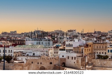 Historical townhouses of the old Medina (Jewish downtown district) in Tangier, Morocco, Africa. Cityscape with traditional Arabic neighborhood buildings in the ancient old town of the Moroccan city. Royalty-Free Stock Photo #2164830523