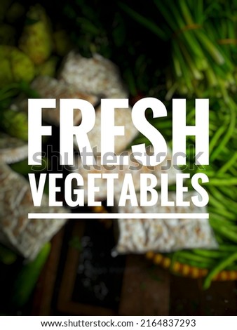 photo of fresh vegetables writing on bright vegetable blur background.