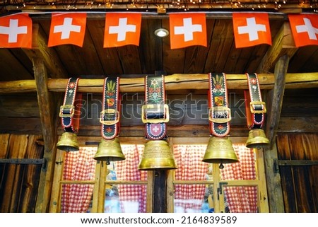 Traditional Swiss Cowbells with flag of Zwitzerland