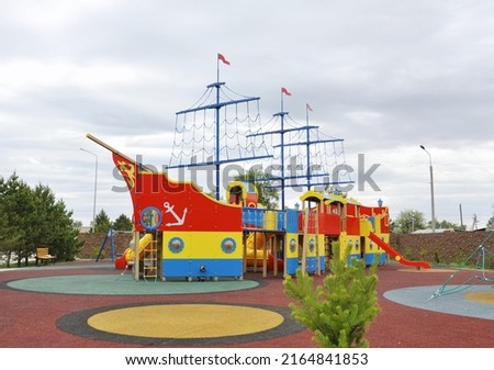 Colorful outdoor ship-shaped children's playground 