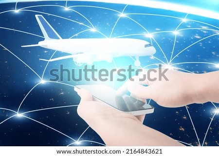 booking tickets online, flight search, summer holidays and vacations, hands with a phone and an airplane on the background of flights around the planet,Element of the image provided by NASA