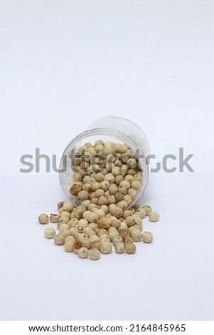 a jar of pepper spilled from the container Royalty-Free Stock Photo #2164845965