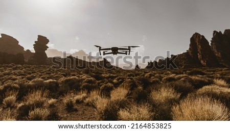 A drone flying over nature and making beautiful pictures and videos.