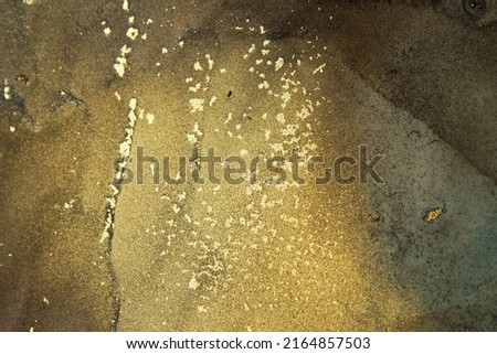 Natural luxury abstract card background alcohol art painting. Gold weins. Liquid glitter gold effect. Ink, paint, abstract wallpapers. Closeup of the painting for web or print design