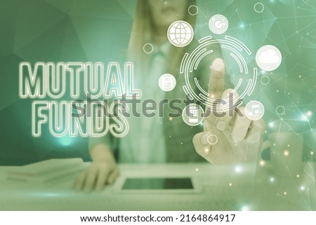Conceptual caption Mutual Funds. Conceptual photo An investment program funded by shareholders Individual Stocks Lady in suit pointing finger upwards symbolizing successful teamwork.