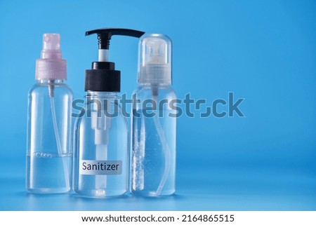 hand sanitizer against blue background