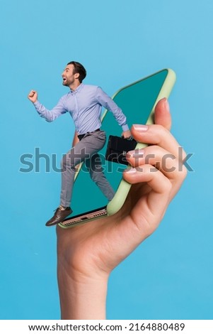 Vertical creative collage image of excited person jump running big telephone screen isolated on blue background Royalty-Free Stock Photo #2164880489