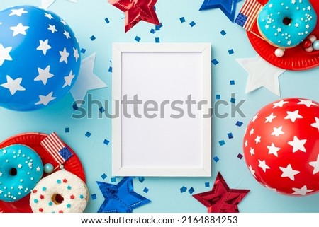 USA Independence Day concept. Top view photo of photo frame balloons stars plates with glazed donuts and confetti on isolated pastel blue background with empty space