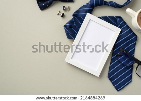 Father's Day concept. Top view photo of white photo frame blue necktie bow-tie glasses cup of coffee and cufflinks on isolated pastel grey background with blank space