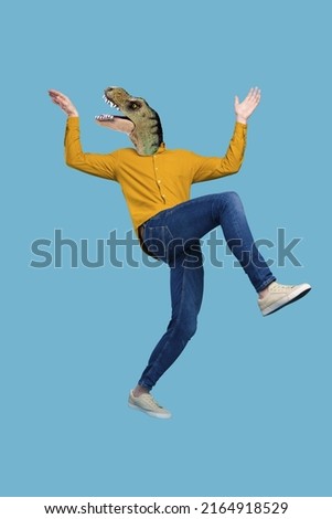 Creative mockup poster of active guy dino face feel crazy panic moving hands up isolated blue color background