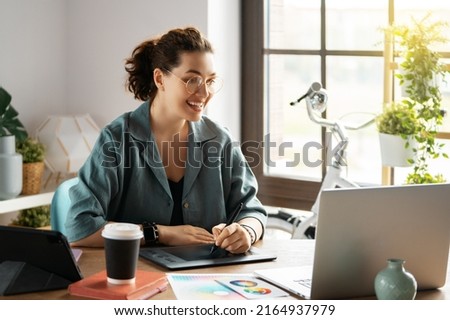 Woman is working in the office. Concept of small business.