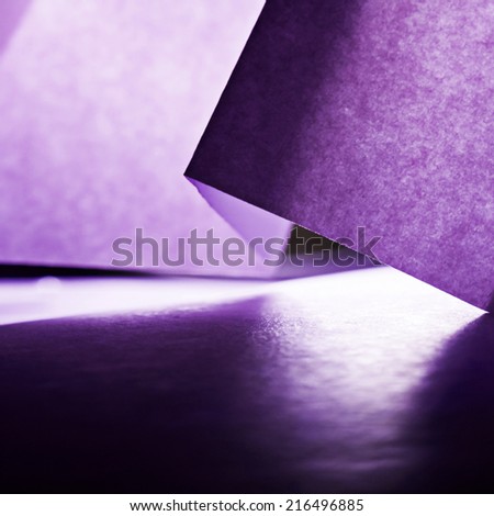 Colorful paper shapes with paper background  