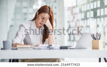 Tired teen girl rubbing dry irritable eyes feel eye strain tension migraine after computer work, exhausted young Asian woman student relieving headache pain, bad weak blurry vision, eyesight problem Royalty-Free Stock Photo #2164977433