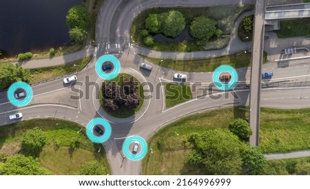Intelligent transport system concept. Smart cars, vehicles with adaptive cruise control, artificial intelligence, sensors, advanced driver assistance system. Drone aerial view of cars in Sweden. Royalty-Free Stock Photo #2164996999