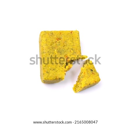 Stock cube isolated. Crumbled vegetable stock concentrat, , broken broth cubes, bouillon cube, instant spice soup ingredient on white background