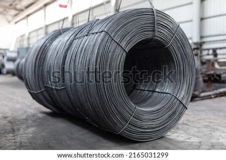 Iron wire in roll. Warehouse of metal products. Royalty-Free Stock Photo #2165031299