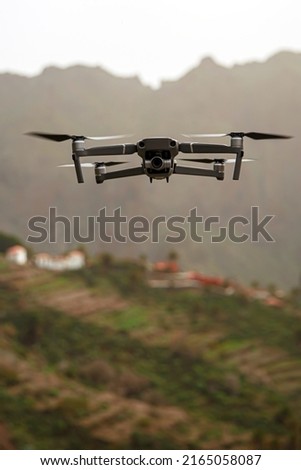 Drone flies and taking photos and videos in the mountains
