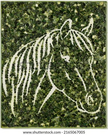 stylized horse head in emerald green
