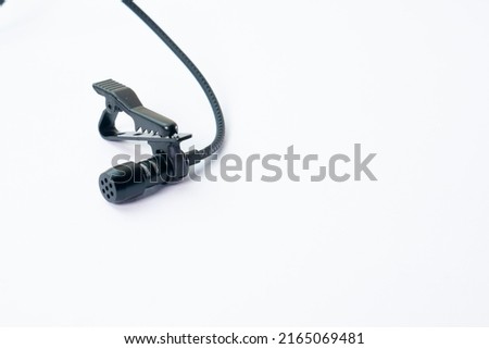 clip on microphone with braided cable isolated on white background