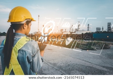 Asian Business Woman with safety hard hat with touches icons Show visual Screen sign of the top service Quality assurance, Guarantee, Standards, ISO certification and standardization concept.