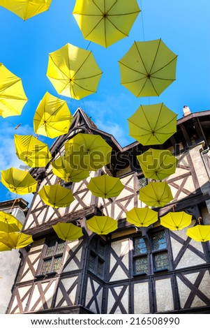 Green upside down umbrellas in a street, Thiers, Puy-de-Dome department in Auvergne (France)