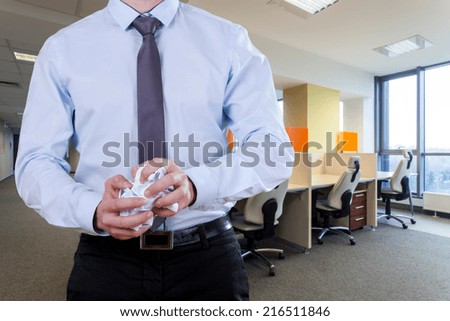 Office worker wearing suit crease invalid papers Royalty-Free Stock Photo #216511846