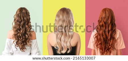 Young women with beautiful wavy hair on colorful background, back view Royalty-Free Stock Photo #2165133007