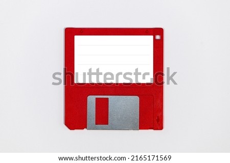 3.5 inch floppy disk in red a retro storage unit