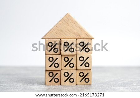 House Model And  wooden block with the percentage. Property investment real estate and house mortgage financial concept.                 