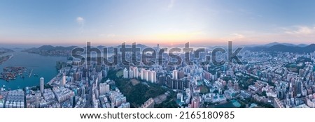 Amazing panorama of Kowloon, the residential and commercial area in the downtown are of Hong Kong, dawn time aerial shot