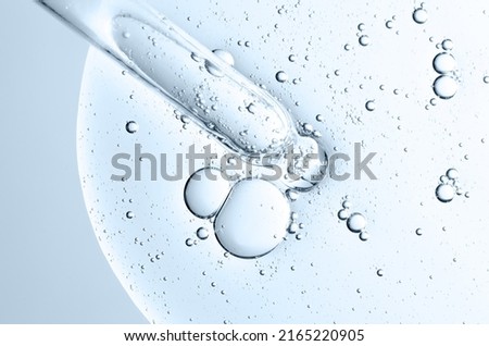 The texture of a cosmetic serum with a pipette closeup. Macrophotography Royalty-Free Stock Photo #2165220905