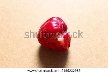 Red Rose Apple on a Pink Background
