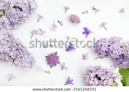 Lilac flower pattern background top view, flat lay.