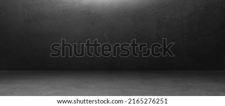 Empty Dark Grey Concrete wall room Studio Background and rough Floor perspective well editing montage displays Product Stage and text present on black, Backdrop Background 