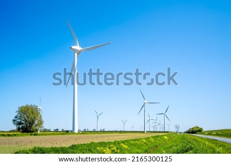 Wind Turbines in Lower Saxony, Germany  Royalty-Free Stock Photo #2165300125